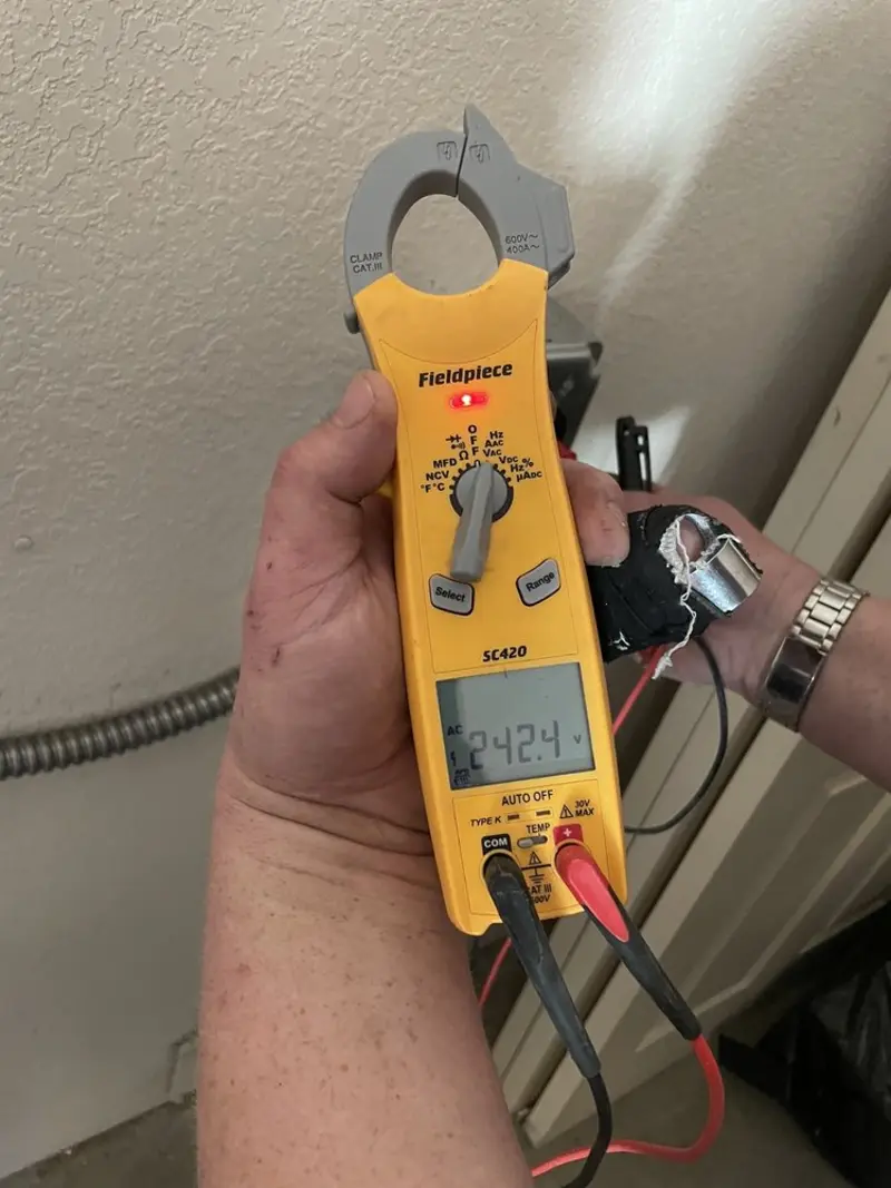 Voltage testing with clamp meter during Ceiling Fan Installation in Harker Heights